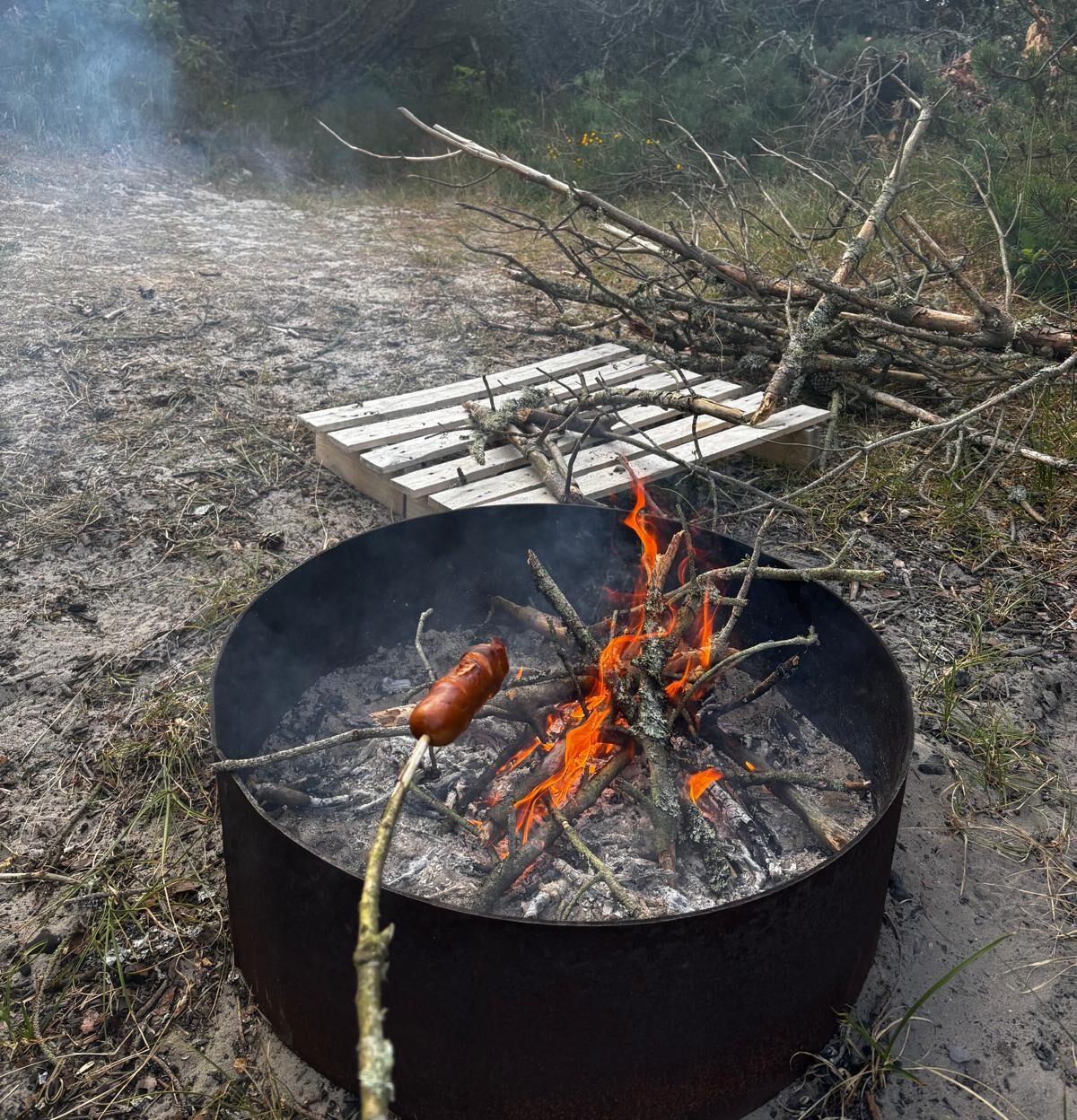 Cooking over a campfire while camping in Denmark