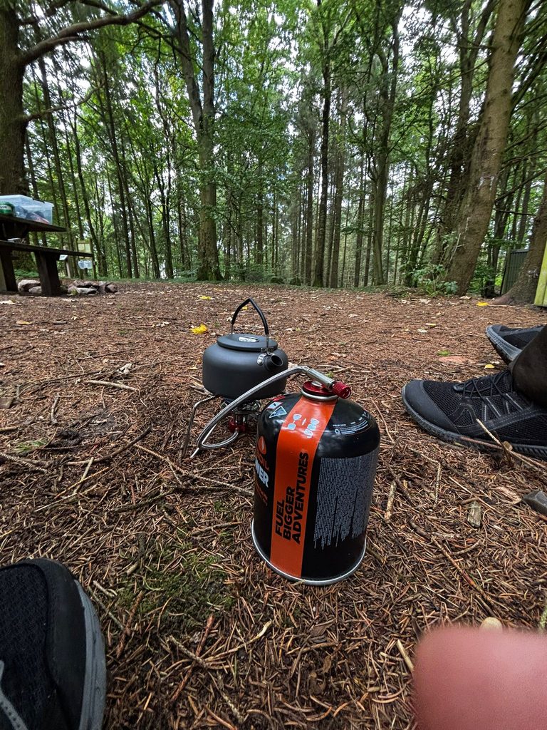 Camping stove and kettle used for cooking at a campsite in Denmark